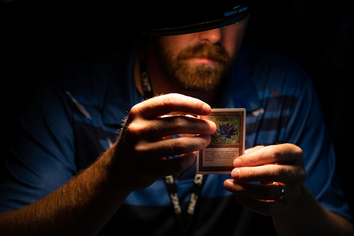 CGC grader grading a trading card